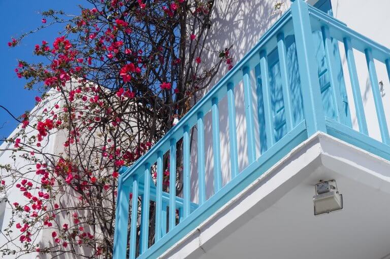 blue balcony and pink flowers in Mykonos